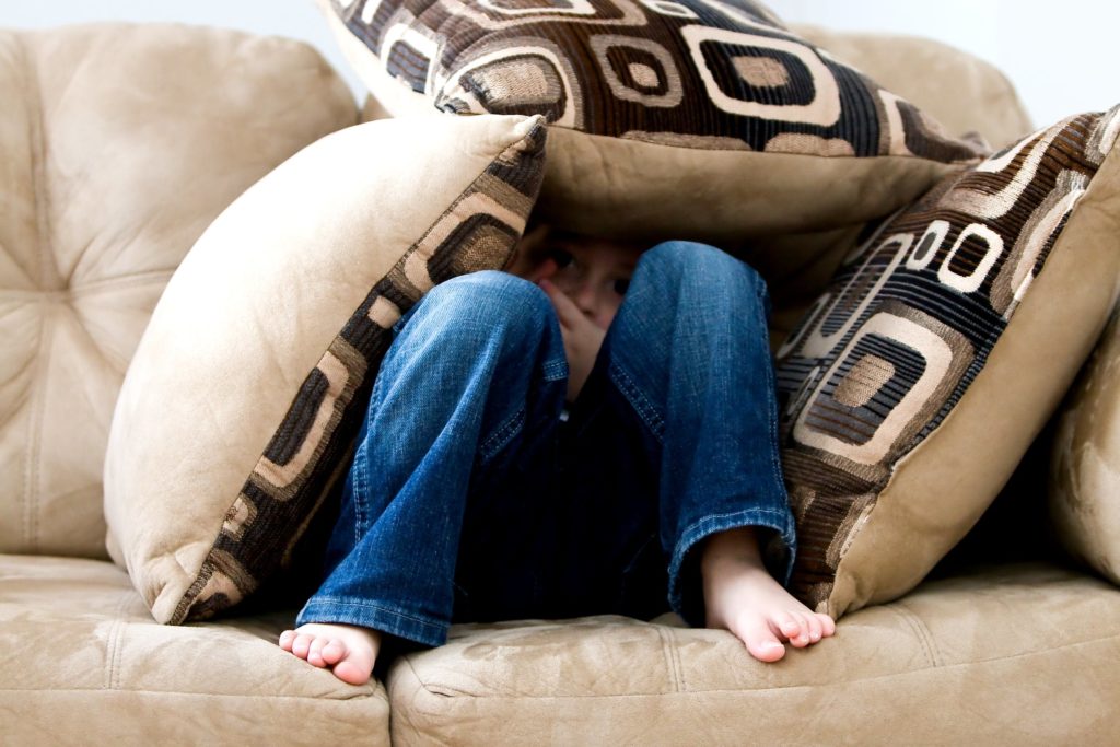 kid hiding because scared of playing horror games